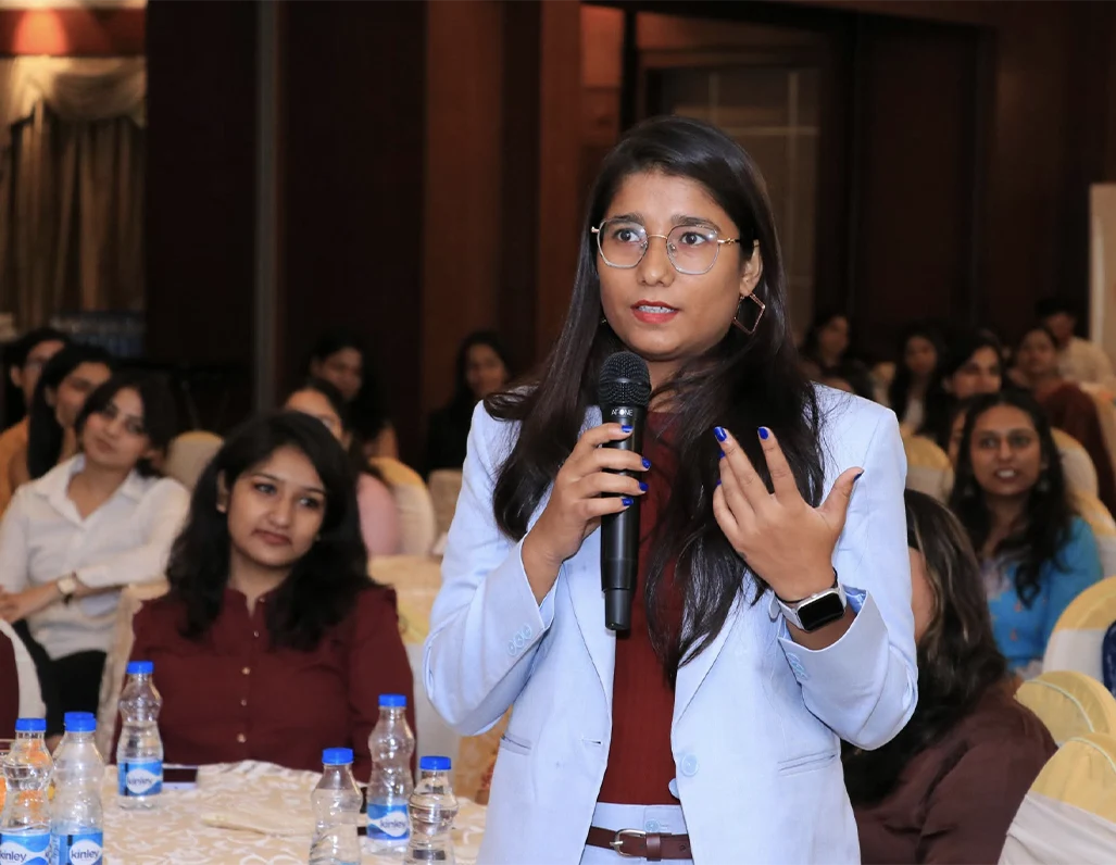 Woman leader addressing Scholars at the Vedica Scholars Programme, supporting experiential leadership learning beyond the classroom